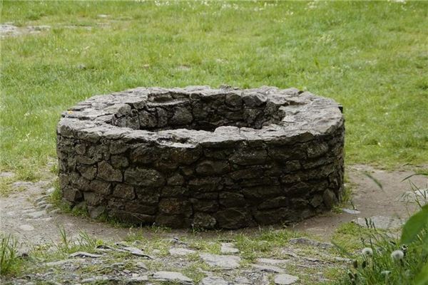 I dreamed of throwing stones into a well.